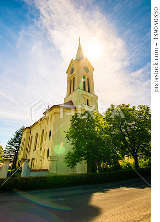 Church of the St. Wenceslaus at Mnisek pod Brdy city, built in gothic style. Church is placed in center of small city near famous chateau. 139050330