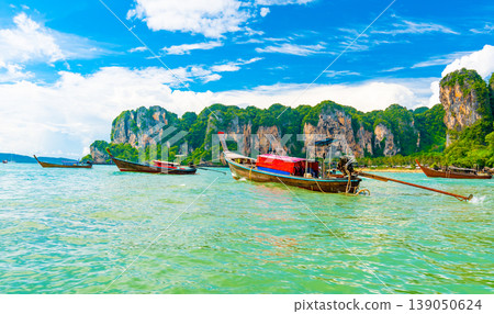 View from boat going to famous Railay beach in Krabi town, Thailand. Favorite place in Thailand with pure sea, white sand and beautiful limestone rocks. Vacation target in tropical paradise. 139050624