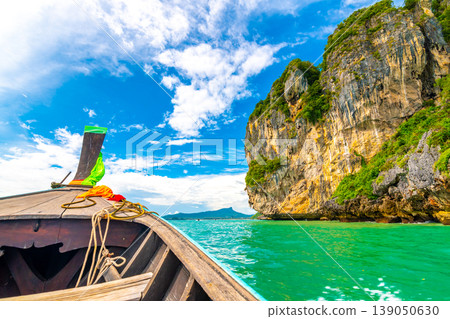 View from boat going to famous Railay beach in Krabi town, Thailand. Favorite place in Thailand with pure sea, white sand and beautiful limestone rocks. Vacation target in tropical paradise. 139050630