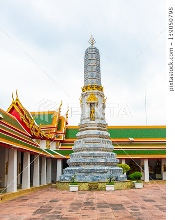 Wat Pho temple in Bangkok city, Thailand. View of pagoda and stupa in famous ancient temple. Religious buildings in buddhism style near Grand Palace. Oriental and Asian style, famous tourist target. Wat Pho temple in Bangkok city, Thailand. View of pagoda and stupa in famous ancient temple. Religious buildings in buddhism style near Grand Palace. Oriental and Asian style, famous tourist target. 139050798