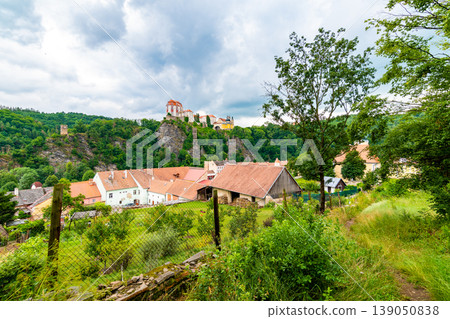 View of beautiful castle Vranov nad Dyji, Moravian region in Czech republic. Ancient chateau built in baroque style, placed on big rock above river near the Vranov village. Cloudy weather. View of beautiful castle Vranov nad Dyji, Moravian region in Czech republic. Ancient chateau built in baroque style, placed on big rock above river near the Vranov village. Cloudy weather. 139050838