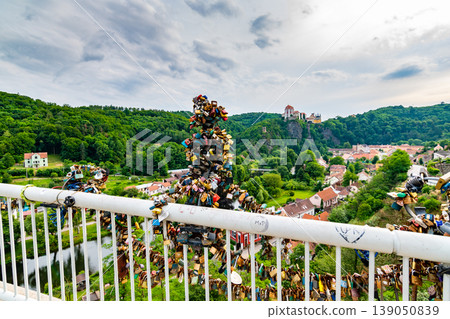 Lock on the bridge as symbol of love in Vranov village, Czech republic. Panoramic view to castle Vranov 139050839