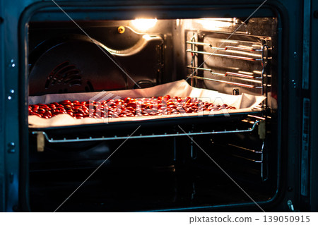 Rose hips (latin name Fructus cynosbati) are drying in oven. Dried rose hips are important source of vitamins in alternative medicine. Colorful image of natural and herb ingredients Rose hips (latin name Fructus cynosbati) are drying in oven. Dried rose hips are important source of vitamins in alternative medicine. Colorful image of natural and herb ingredients 139050915