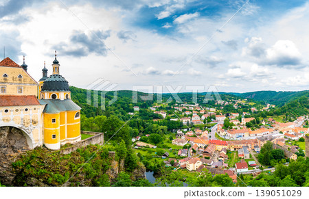 View of beautiful castle Vranov nad Dyji, Moravian region in Czech republic. Ancient chateau built in baroque style, placed on big rock above river near the Vranov village. Cloudy weather. 139051029