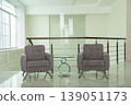 Modern office lounge area with gray armchairs and glass table. 139051173