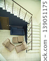Top view of modern living room area with stairs and sofa. 139051175