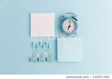 Blue School Stationery Flat Lay with Alarm Clock Blue School Stationery Flat Lay with Alarm Clock 139051400