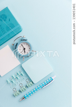 Blue School Stationery Flat Lay with Alarm Clock Blue School Stationery Flat Lay with Alarm Clock 139051401