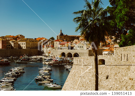 Amazing view of Dubrovnik old city and the boats in a marina on a sunny day. Travel destination in Croatia. 139051413