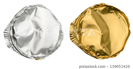 Two round foil lids in silver and gold on an insulated background Two round foil lids in silver and gold on an insulated background 139051420