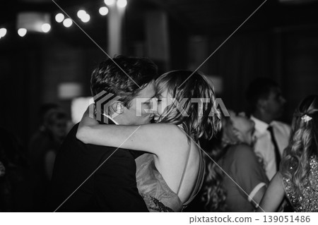 Couple kissing romantic intimacy embrace wedding celebration 139051486