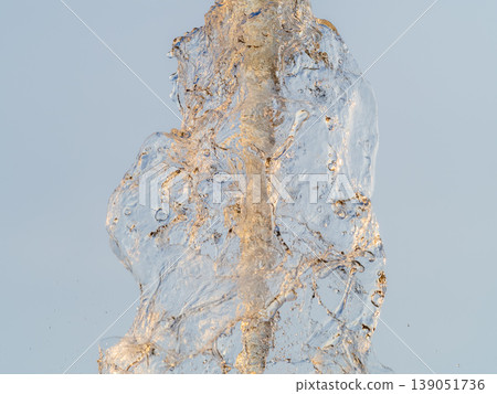 Splashes and jets of water against light background. 139051736