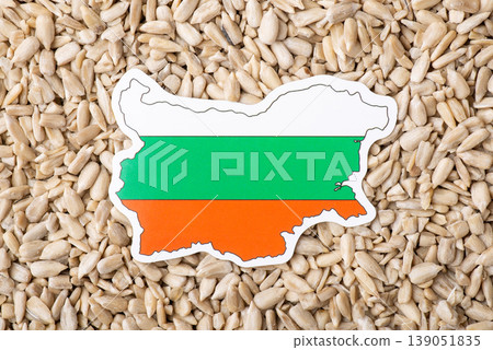 Flag and map of Bulgaria on peeled sunflower seeds. Growing sunflowers in Bulgaria, origin concept Flag and map of Bulgaria on peeled sunflower seeds. Growing sunflowers in Bulgaria, origin concept 139051835