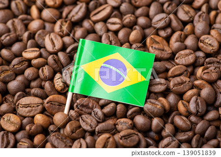 Flag of Brazil in roasted coffee beans. Growing coffee in Brazil concept, origin of coffee grain Flag of Brazil in roasted coffee beans. Growing coffee in Brazil concept, origin of coffee grain 139051839
