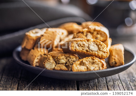 Crunchy Almond Biscotti cantuccini on a Rustic Plate, Perfect for Coffee or Tea Breaks Crunchy Almond Biscotti cantuccini on a Rustic Plate, Perfect for Coffee or Tea Breaks 139052174