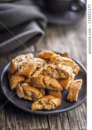 Crunchy Almond Biscotti cantuccini on a Rustic Plate, Perfect for Coffee or Tea Breaks 139052175