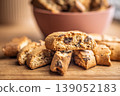 Crunchy Almond Biscotti cantuccini Stacked on Rustic Wooden Board Close-Up, Italian Twice-Baked Cookies 139052183