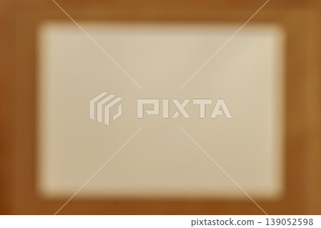 Blurred rectangular light frame on warm brown gradient background, soft vignette edges, abstract backdrop for design use. Abstract background blur, copy space for presentation layout, mockup Blurred rectangular light frame on warm brown gradient background, soft vignette edges, abstract backdrop for design use. Abstract background blur, copy space for presentation layout, mockup 139052598