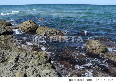 The rocky landscape of the Shonai coast where rocky shores of strangely shaped rocks continue 139052796