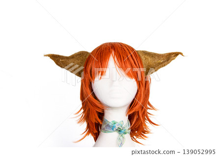 White foam mannequin head wearing an elf ears headpiece and red wig, perfect for cosplay, costume design, and fantasy White foam mannequin head wearing an elf ears headpiece and red wig, perfect for cosplay, costume design, and fantasy 139052995