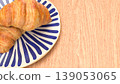 Fresh Croissant Breakfast on Plate with Wooden Table Background 3d render. 139053065
