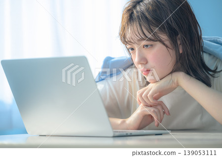 A young woman working on her laptop: Happy Pop A young woman working on her laptop: Happy Pop 139053111
