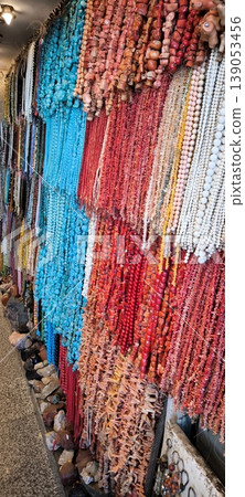A bright variety of beads and jewelry made from natural stones A bright variety of beads and jewelry made from natural stones 139053456