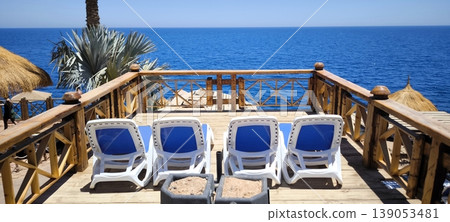 Sun loungers on the terrace overlooking the sea Sun loungers on the terrace overlooking the sea 139053481