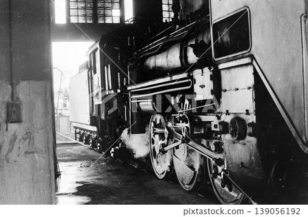 Steam locomotive inside the engine shed 139056192