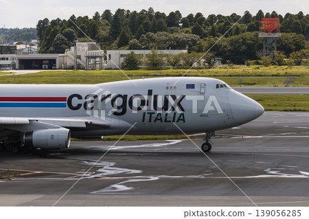 A Cargolux Italy cargo plane taxiing at Narita Airport. A Cargolux Italy cargo plane taxiing at Narita Airport. 139056285