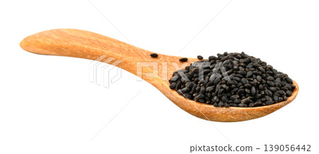 Heap of black basil seeds or nigella seeds on a small wooden spoon isolated. Close-up view of organic superfood spice for healthy cooking and culinary ingredients. Heap of black basil seeds or nigella seeds on a small wooden spoon isolated. Close-up view of organic superfood spice for healthy cooking and culinary ingredients. 139056442