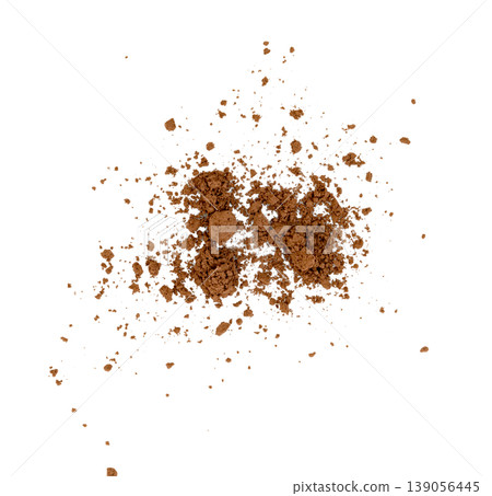Scattered cocoa powder or coffee grounds. Overhead view of brown crushed powder texture with clumps and fine particles. Concept of food ingredients or cosmetic makeup. Scattered cocoa powder or coffee grounds. Overhead view of brown crushed powder texture with clumps and fine particles. Concept of food ingredients or cosmetic makeup. 139056445