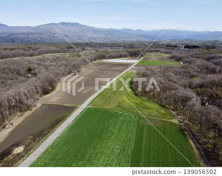 Aerial view of Mount Asama and spring farmland from the Kitakaruizawa area of Tsumagoi Village, Gunma Prefecture. Aerial view of Mount Asama and spring farmland from the Kitakaruizawa area of Tsumagoi Village, Gunma Prefecture. 139056502