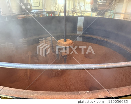A traditional floor malting process at a whisky distillery on the Isle of Islay in Scotland. A traditional floor malting process at a whisky distillery on the Isle of Islay in Scotland. 139056685