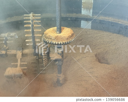 A traditional floor malting process at a whisky distillery on the Isle of Islay in Scotland. A traditional floor malting process at a whisky distillery on the Isle of Islay in Scotland. 139056686