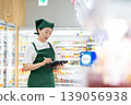 A woman who manages merchandise at a supermarket 139056938