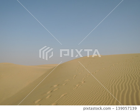 Enjoy a camel safari in the Thar Desert outside Jaisalmer, Rajasthan, India. Enjoy a camel safari in the Thar Desert outside Jaisalmer, Rajasthan, India. 139057139