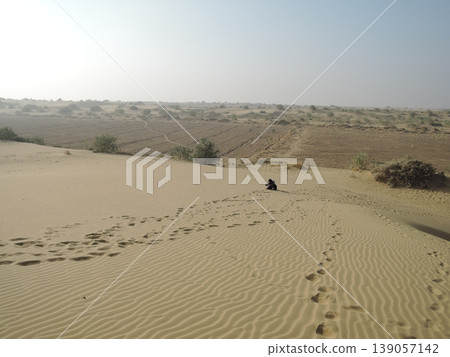 Enjoy a camel safari in the Thar Desert outside Jaisalmer, Rajasthan, India. Enjoy a camel safari in the Thar Desert outside Jaisalmer, Rajasthan, India. 139057142