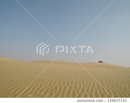 Enjoy a camel safari in the Thar Desert outside Jaisalmer, Rajasthan, India. Enjoy a camel safari in the Thar Desert outside Jaisalmer, Rajasthan, India. 139057143