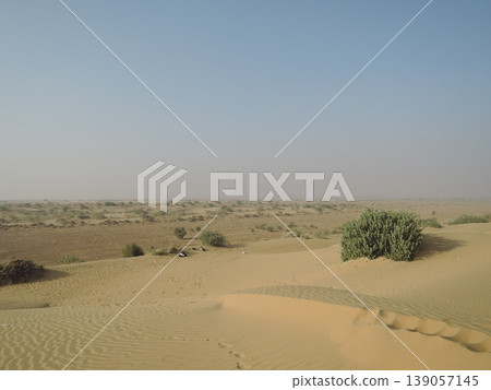 Enjoy a camel safari in the Thar Desert outside Jaisalmer, Rajasthan, India. Enjoy a camel safari in the Thar Desert outside Jaisalmer, Rajasthan, India. 139057145