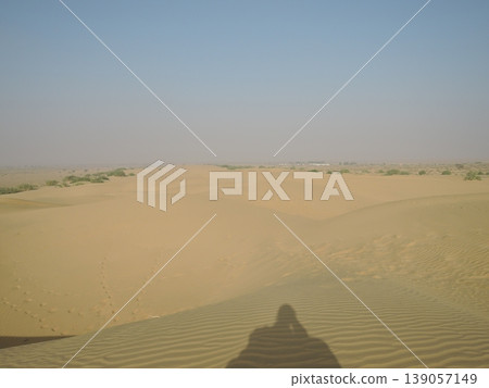 Enjoy a camel safari in the Thar Desert outside Jaisalmer, Rajasthan, India. Enjoy a camel safari in the Thar Desert outside Jaisalmer, Rajasthan, India. 139057149