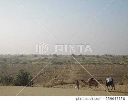 Enjoy a camel safari in the Thar Desert outside Jaisalmer, Rajasthan, India. Enjoy a camel safari in the Thar Desert outside Jaisalmer, Rajasthan, India. 139057158
