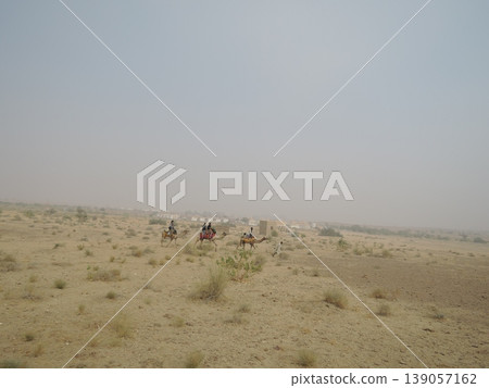 Enjoy a camel safari in the Thar Desert outside Jaisalmer, Rajasthan, India. Enjoy a camel safari in the Thar Desert outside Jaisalmer, Rajasthan, India. 139057162