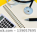 Stethoscope and calculator 139057695