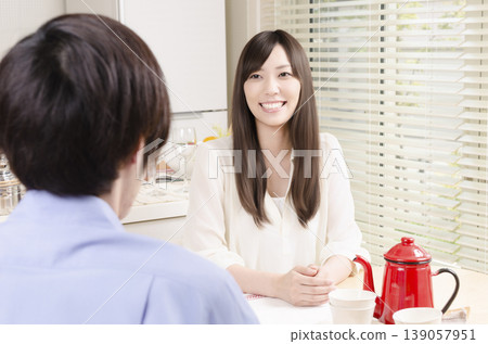 A young couple chatting at home A young couple chatting at home 139057951