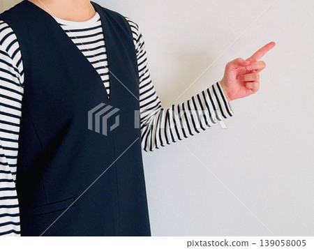 A woman with fingers pointing A woman with fingers pointing 139058005