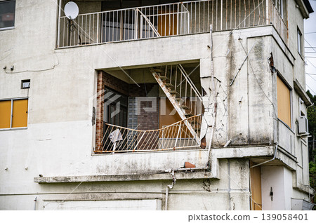 Disaster remains from the Great East Japan Earthquake: The second floor of a house damaged by the tsunami and a damaged staircase. Disaster remains from the Great East Japan Earthquake: The second floor of a house damaged by the tsunami and a damaged staircase. 139058401