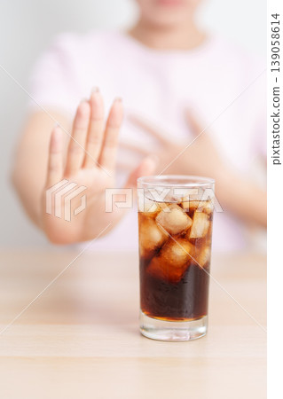 Woman hand stop and refuse gesture to carbonated soft drink, feeling Abdominal pain after drinking soda water, bloating and gas in digestive system, stomach ache, Acid reflux, Heartburn and Gastritis Woman hand stop and refuse gesture to carbonated soft drink, feeling Abdominal pain after drinking soda water, bloating and gas in digestive system, stomach ache, Acid reflux, Heartburn and Gastritis 139058614