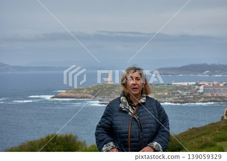 Woman strolling through Monte de San Pedro Park in A Coruna with panoramic views of the city. Woman strolling through Monte de San Pedro Park in A Coruna with panoramic views of the city. 139059329