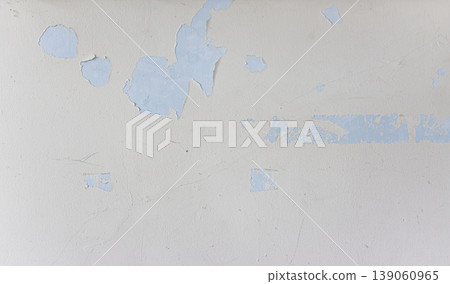 An old wall surface with peeling paint and cracking. An old wall surface with peeling paint and cracking. 139060965